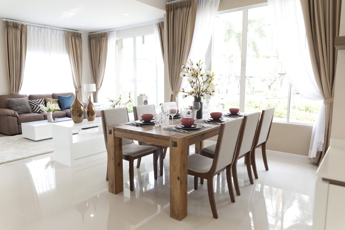 Image depicts the featured image for the blog Dining Room Flooring Suggestions which shows a dining room with white tile floors.