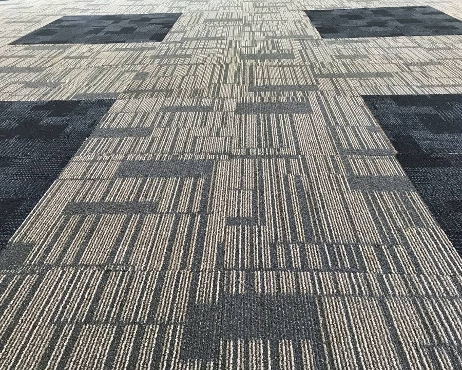 Image depicts carpet tiles installed in an office space.