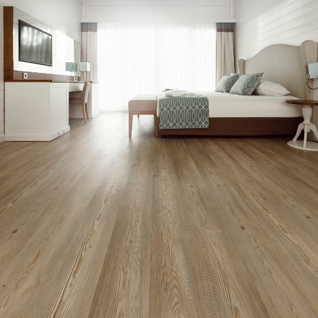 Image depicts a bedroom with maple hardwood floors.