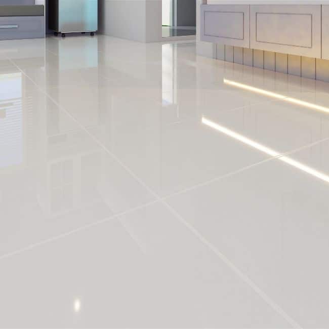 Image depicts new white tile floors installed in a home.