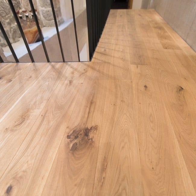 Image depicts white oak hardwood floors in a home.
