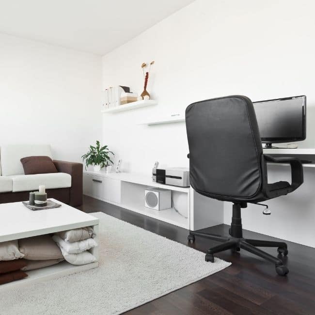 Image depicts a living room with sucupira hardwood floors installed.