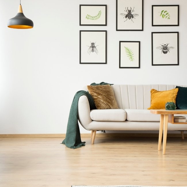 Image depicts a living room with yellow birch hardwood floors.