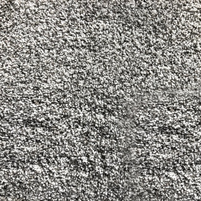 Image depicts a close of of a carpet in a Brampton home.