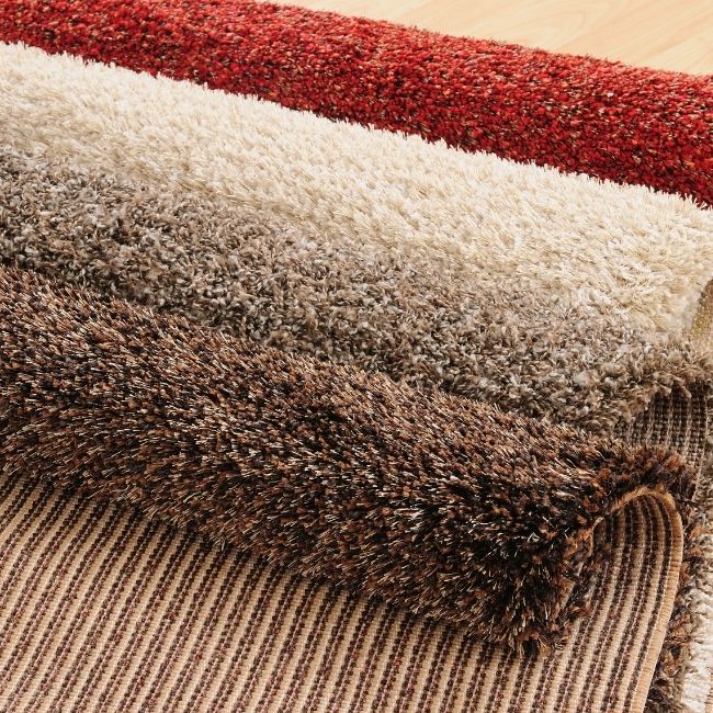 Image depicts samples of carpets for sale in Oshawa.