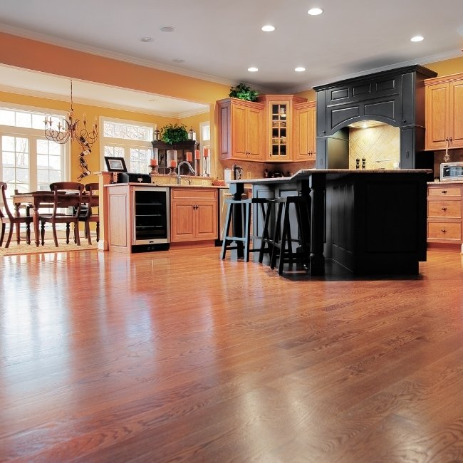 Image depicts the interior of a London home with newly installed hardwood floors.