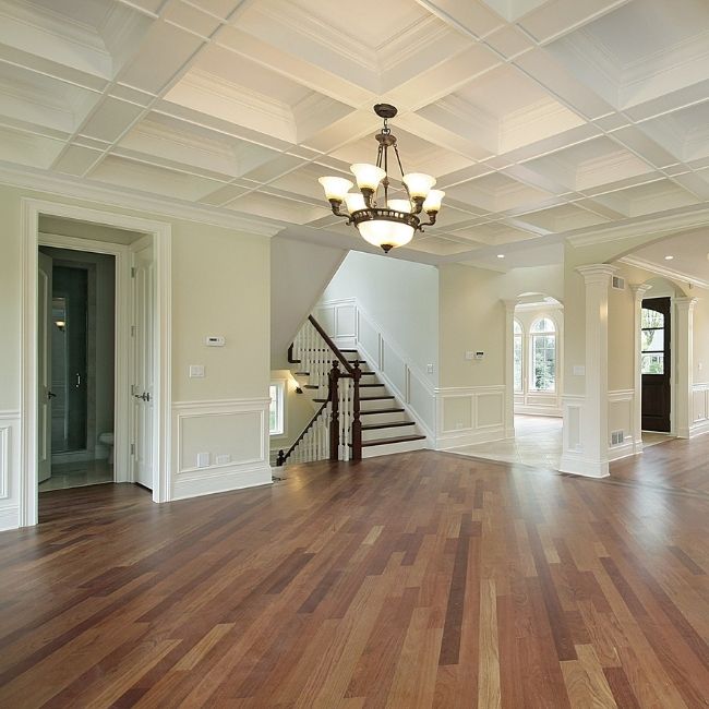 Image depicts the interior of a Newmarket home with newly-installed hardwood floors.