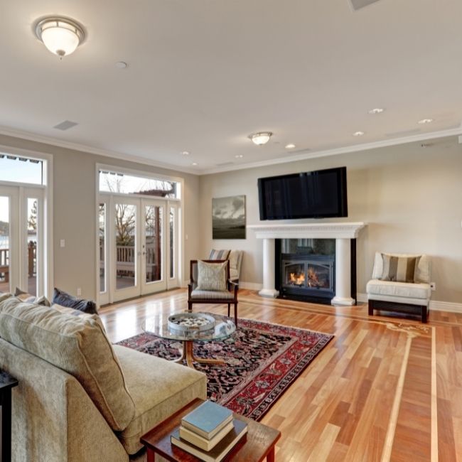 Image depicts a living room in Toronto with new hardwood floors.