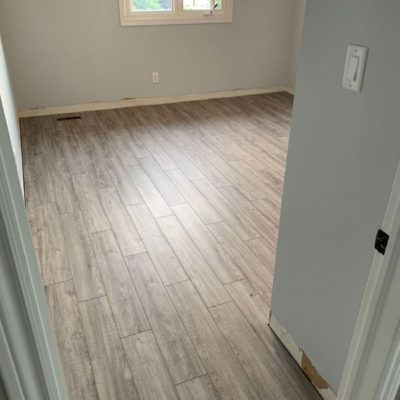 Image depicts a laminate flooring installation project in Mississauga by Flooring Liquidators.