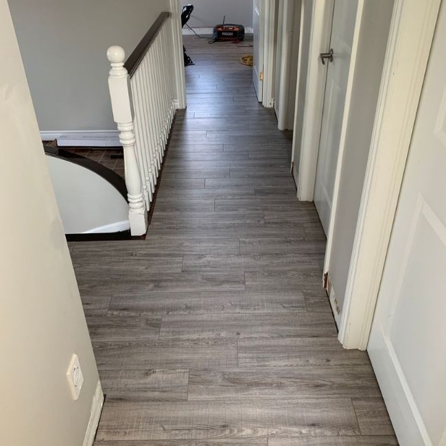 Image depicts a laminate flooring installation project in Mississauga by Flooring Liquidators.