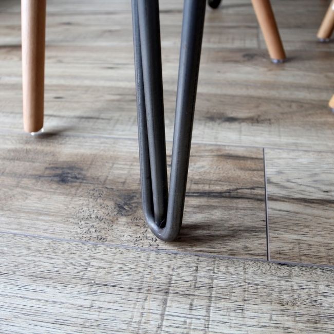 Image depicts a close-up of newly installed laminate floors in a London home.