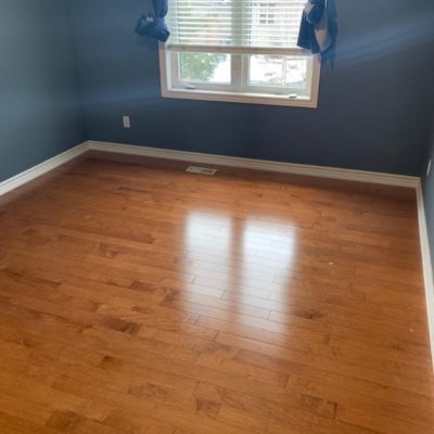 Image depicts a solid hardwood flooring installation project in London, Ontario.