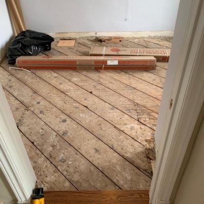 Image depicts a solid hardwood flooring installation project in London, Ontario.