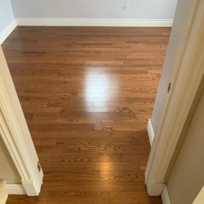Image depicts a solid hardwood flooring installation project in London, Ontario.