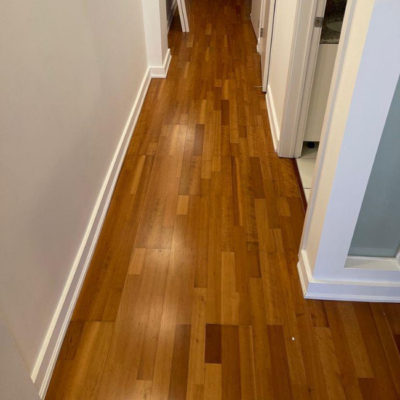 Image depicts old floors from an engineered hardwood flooring installation project in Toronto, Ontario.