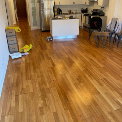 Image depicts old floors from an engineered hardwood flooring installation project in Toronto, Ontario.