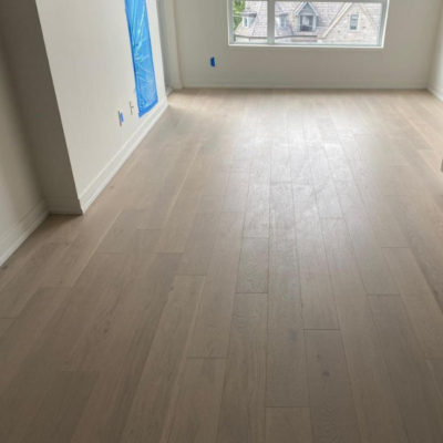 Image depicts new floors from an engineered hardwood flooring installation project in Toronto, Ontario.