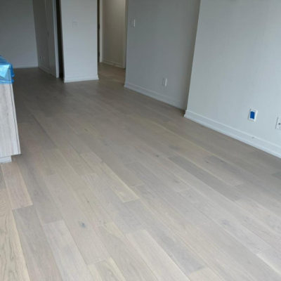 Image depicts new floors from an engineered hardwood flooring installation project in Toronto, Ontario.