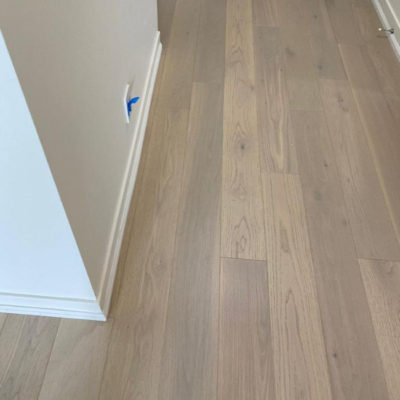 Image depicts new floors from an engineered hardwood flooring installation project in Toronto, Ontario.