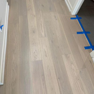 Image depicts new floors from an engineered hardwood flooring installation project in Toronto, Ontario.