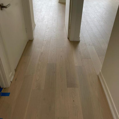 Image depicts new floors from an engineered hardwood flooring installation project in Toronto, Ontario.