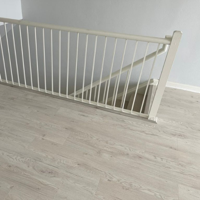 Image depicts new floors from a laminate and carpet flooring installation project in Toronto, Ontario.