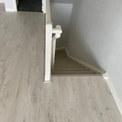 Image depicts new floors from a laminate and carpet flooring installation project in Toronto, Ontario.