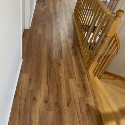 Image depicts new floors from a laminate flooring installation project in Mississauga, Ontario.