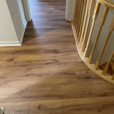 Image depicts new floors from a laminate flooring installation project in Mississauga, Ontario.