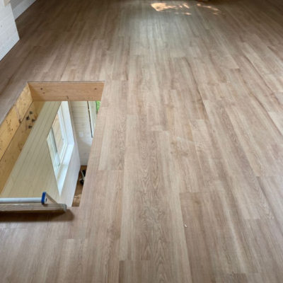 Image depicts new floors from a loose lay vinyl flooring installation project in London, Ontario.