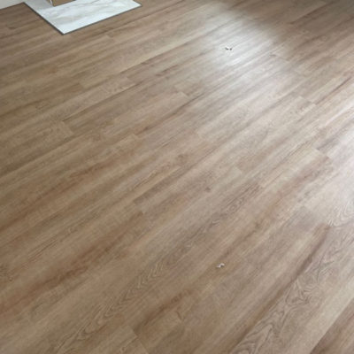 Image depicts new floors from a loose lay vinyl flooring installation project in London, Ontario.