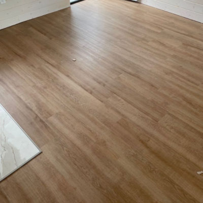 Image depicts new floors from a loose lay vinyl flooring installation project in London, Ontario.