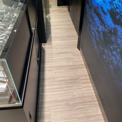 Image depicts new floors from a commercial loose lay vinyl glue down flooring installation project in Brampton, Ontario.