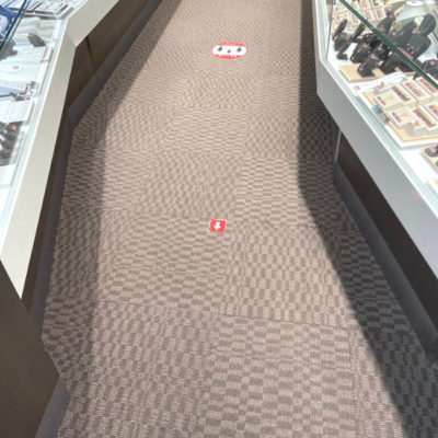 Image depicts old floors from a commercial loose lay vinyl glue down flooring installation project in Brampton, Ontario.