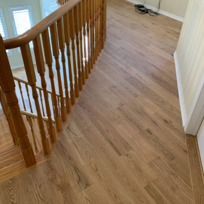 Image depicts new floors from a solid hardwood flooring installation project in Georgetown, Ontario.