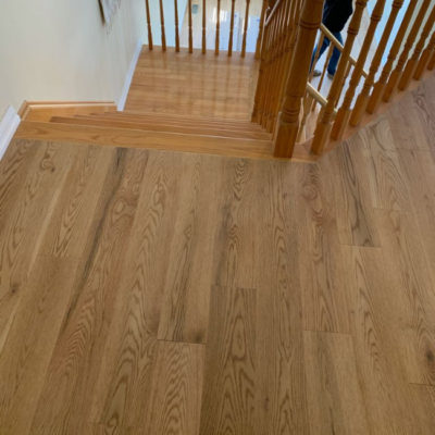 Image depicts new floors from a solid hardwood flooring installation project in Georgetown, Ontario.