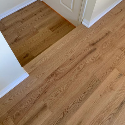 Image depicts new floors from a solid hardwood flooring installation project in Georgetown, Ontario.