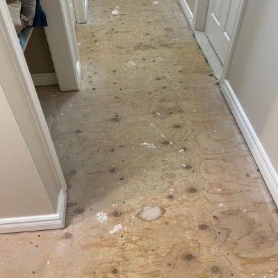 Image depicts old floors from a solid hardwood flooring installation project in London, Ontario.