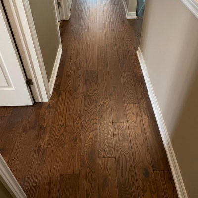 Image depicts new floors from a solid hardwood flooring installation project in London, Ontario.