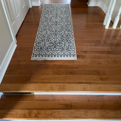 Image depicts new floors from a solid hardwood flooring installation project in London, Ontario.