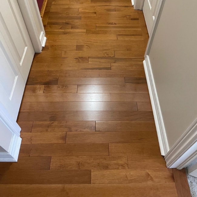 Image depicts new floors from a solid hardwood flooring installation project in London, Ontario.