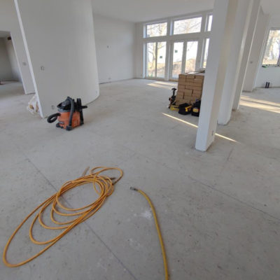 Image depicts old floors from a solid hardwood flooring installation project in Sarnia, Ontario.