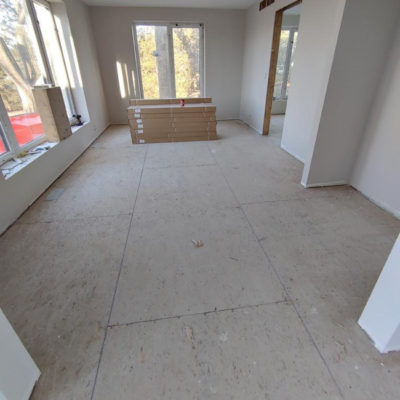 Image depicts old floors from a solid hardwood flooring installation project in Sarnia, Ontario.