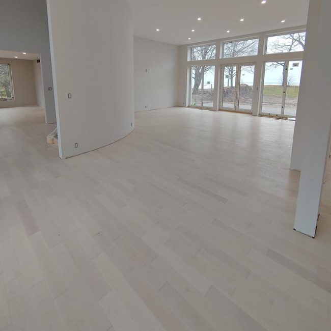 Image depicts new floors from a solid hardwood flooring installation project in Sarnia, Ontario.