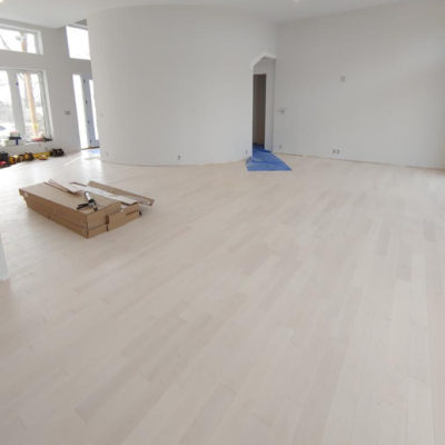 Image depicts new floors from a solid hardwood flooring installation project in Sarnia, Ontario.