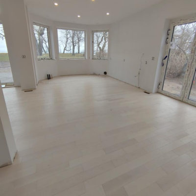 Image depicts new floors from a solid hardwood flooring installation project in Sarnia, Ontario.