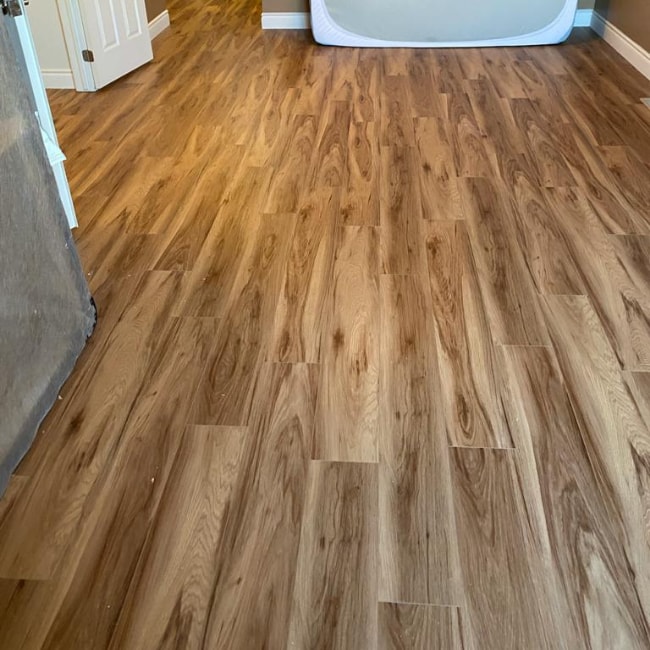 Image depicts new floors from a vinyl flooring installation project in Milton, Ontario.