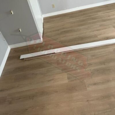 installing light brown vinyl flooring in condo