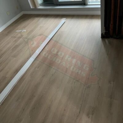 installing light brown vinyl floors in condo