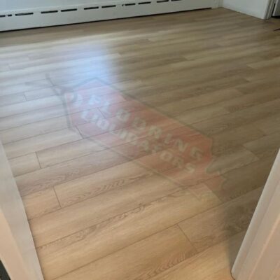 vinyl flooring being installed in renovated house